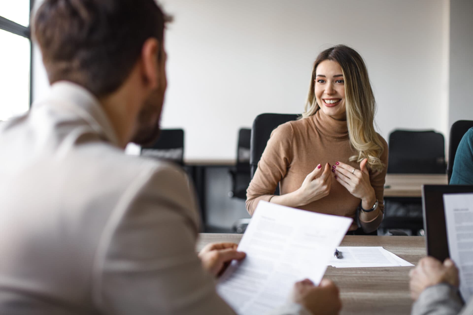 A candidate sharing her experience in a welcoming interview